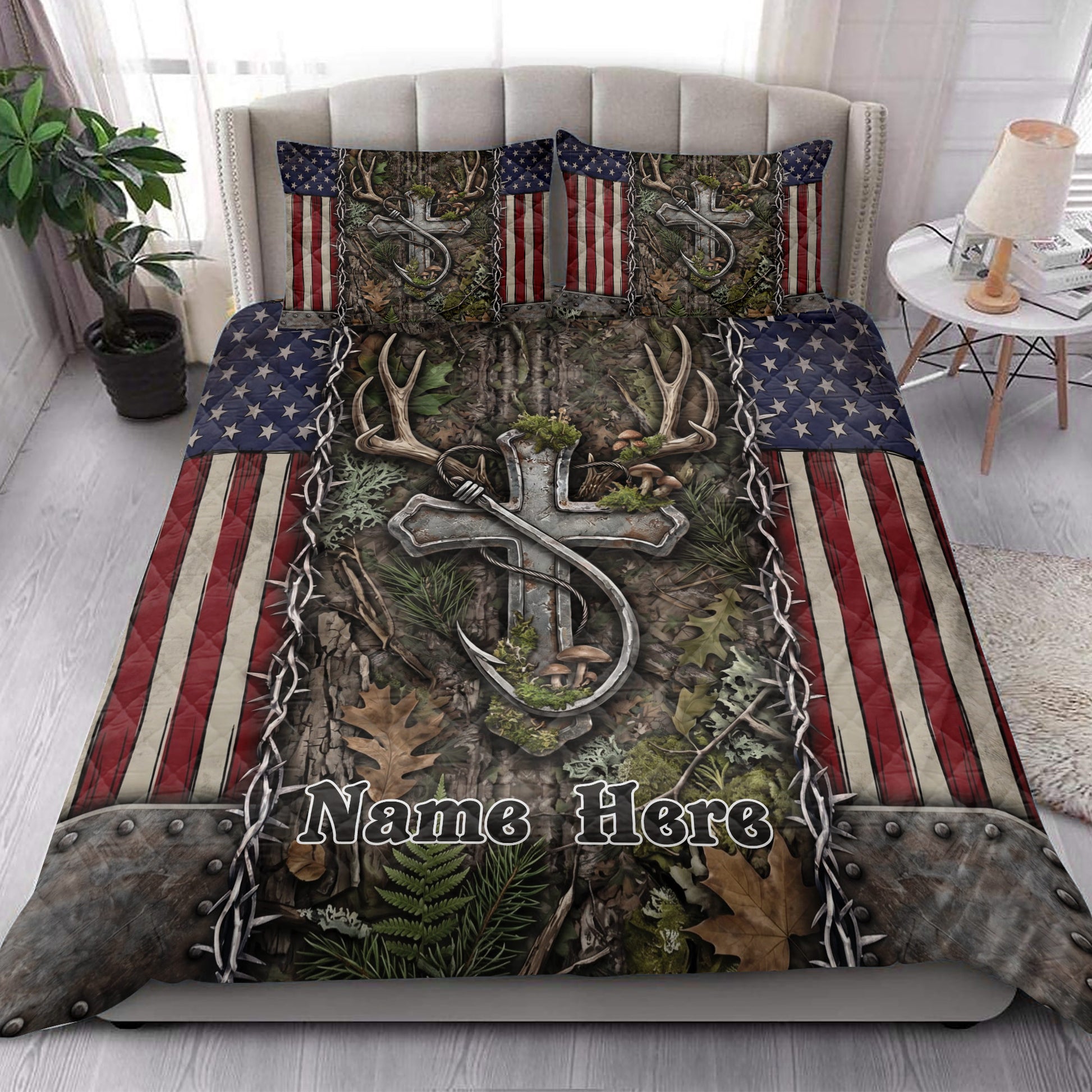 Hunting quilt blanket styled in a bright bedroom with deer antlers, camouflage leaves, and patriotic accents