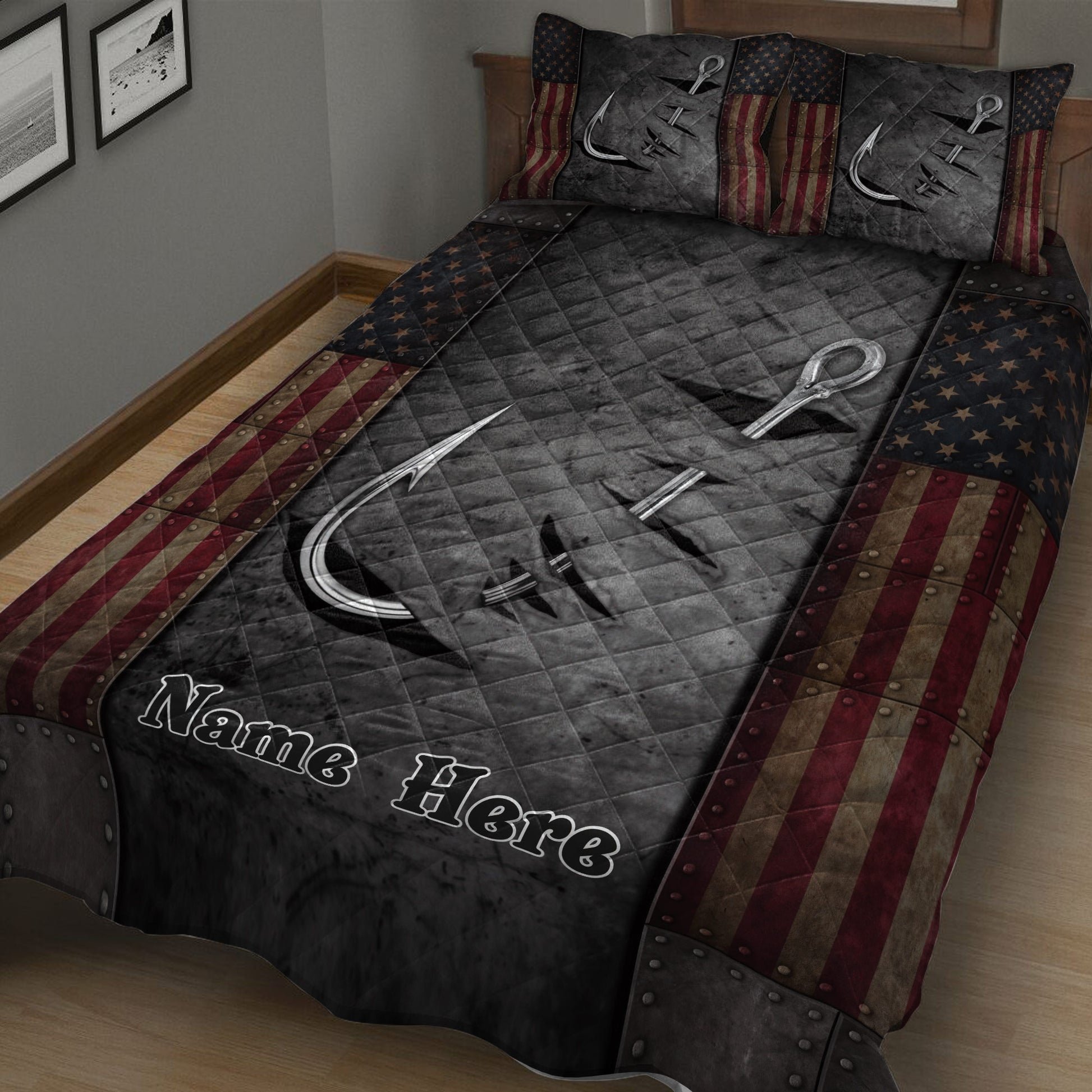 Angler-themed quilt blanket displayed on a bed with fishing hooks, dark textures, stars, and bold striped borders