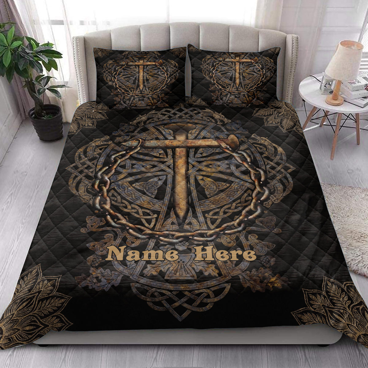 Christian cross quilt blanket displayed on a modern bed with matching cross artwork and black-gold decor