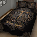 Close bedroom view of a black Christian cross quilt with Celtic knotwork, chain details, and ornate borders