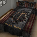 Close view of Christian quilt bedding with a cross, crown of thorns, stars, and flag-inspired borders