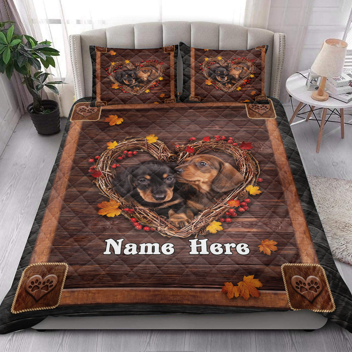 Dachshund quilt bedding styled on a bedroom bed with autumn leaves and rustic wood artwork