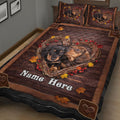 Close view of dachshund dogs in a heart-shaped autumn wreath on a rustic quilt blanket