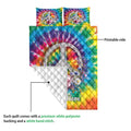 Hippie quilt blanket showing the vibrant printed front, floral peace symbol artwork, and white quilt backing