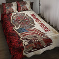 Firefighter quilt blanket displayed on a bed with fire truck artwork, patriotic flag details, and red accents