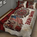 Close bedroom view of a firefighter quilt featuring a large fire department emblem, fire truck, and patriotic design