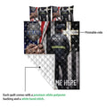 Police quilt blanket showing the printed front, white quilted backing, officer artwork, badge imagery, and dog tags