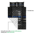 Police quilt blanket shown with printed black and blue badge design and white quilted backing