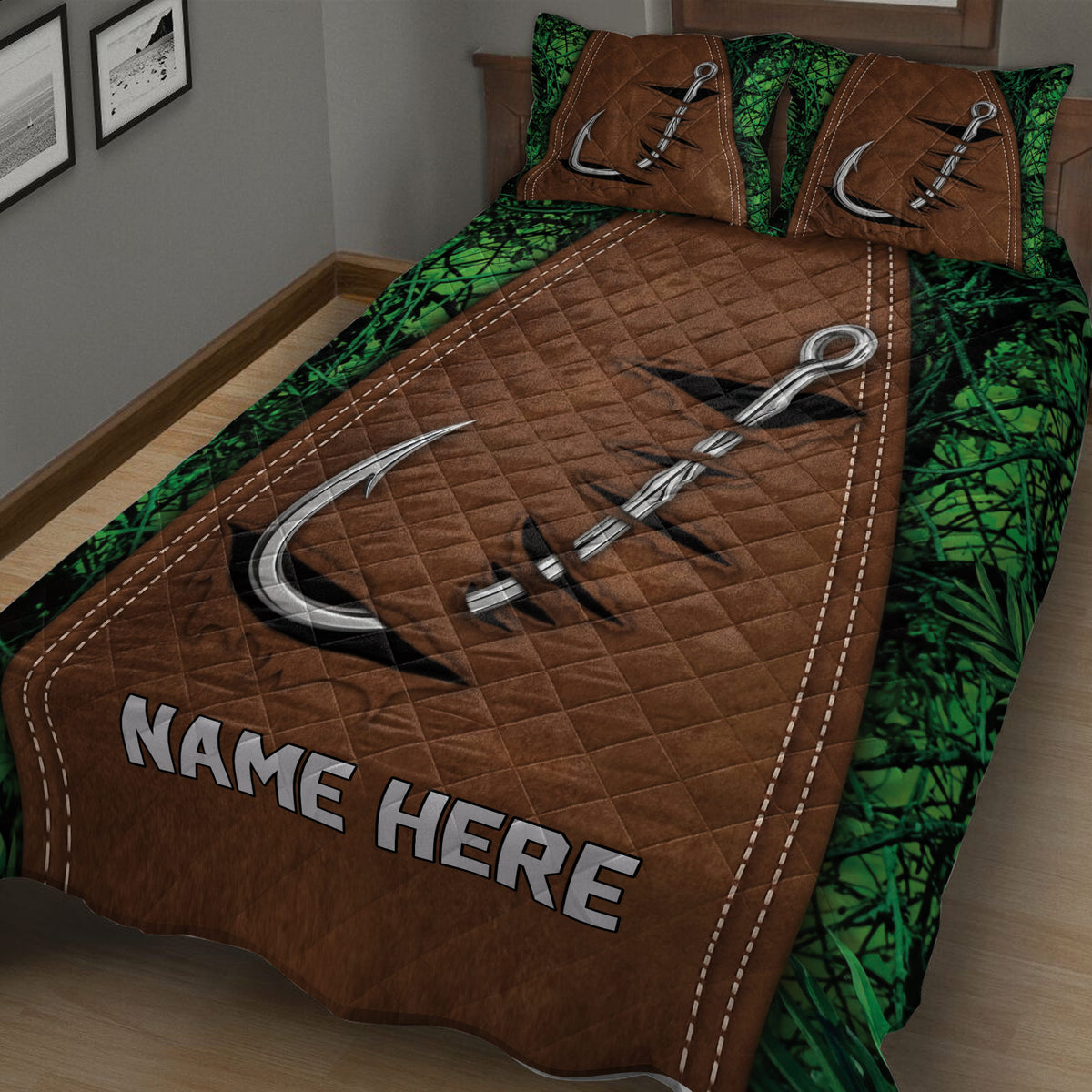 Close view of fishing quilt blanket with large silver hooks, brown quilted center, and green foliage border