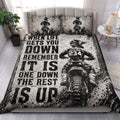 Motocross quilt blanket styled in a bedroom with dirt bike rider artwork and dramatic black and white graphics