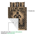 Motocross quilt blanket with folded corner showing the printed rider design and quilted backing