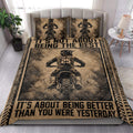 Motocross quilt blanket styled in a bright bedroom with dirt bike rider artwork and tire-track borders