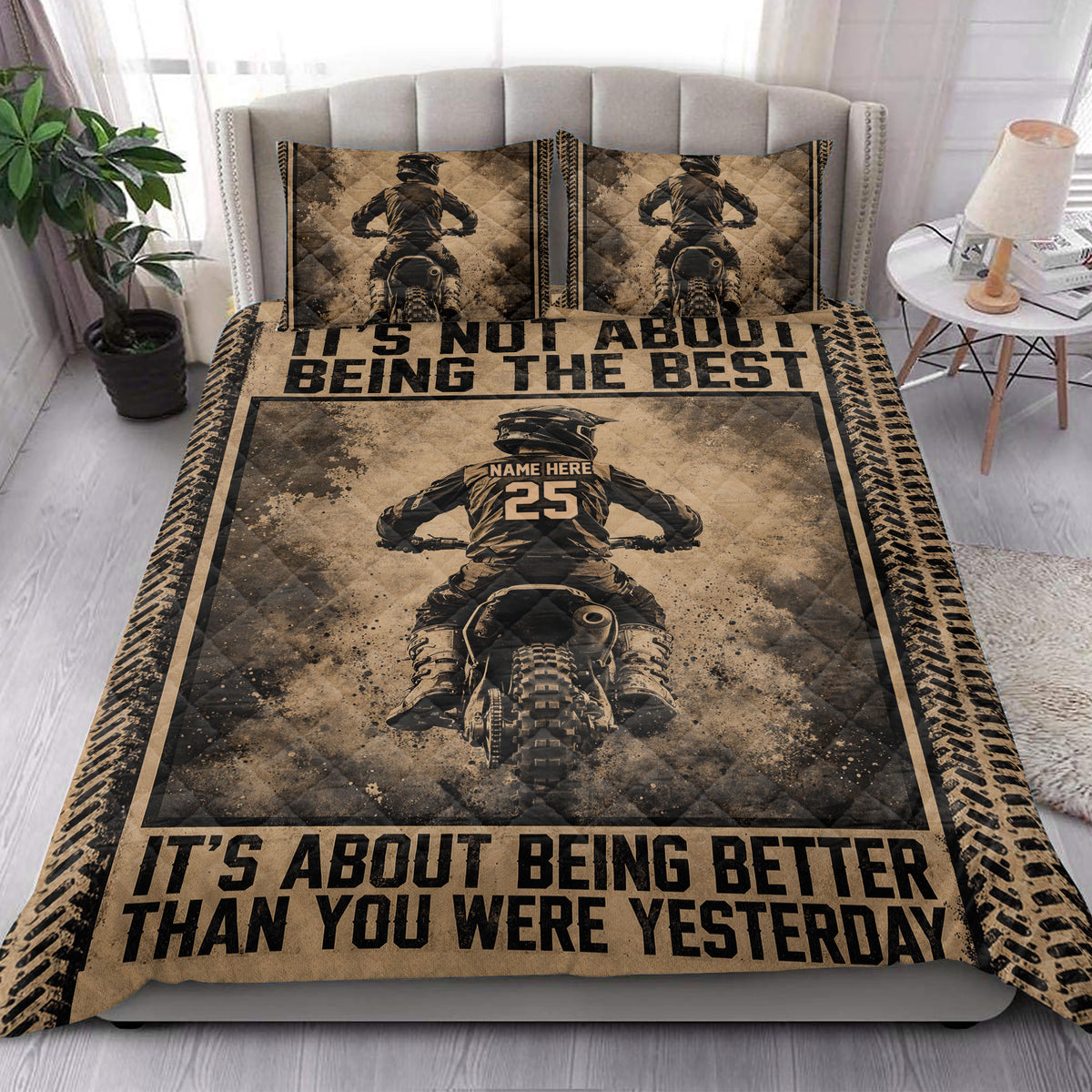 Motocross quilt blanket styled in a bright bedroom with dirt bike rider artwork and tire-track borders