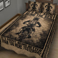 Close-up of motocross quilt bedding with dirt bike rider artwork and bold motivational design