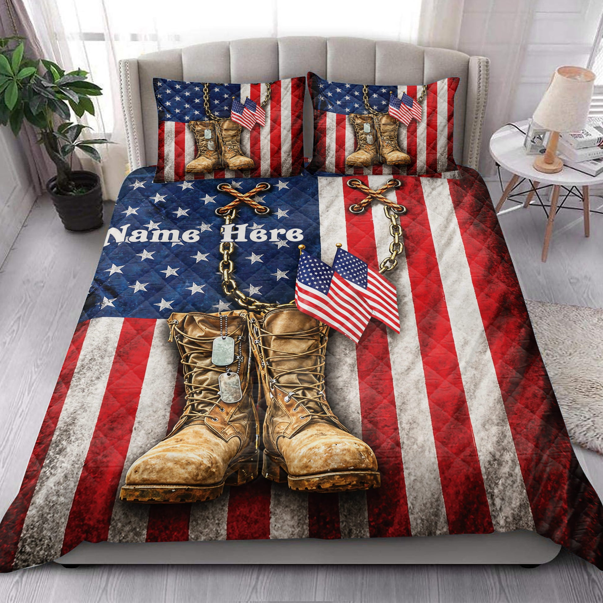 Patriotic veteran quilt blanket styled on a bed with combat boots, dog tags, flags, and American flag stripes
