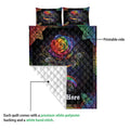 LGBT rainbow rose quilt showing the colorful printed side and white quilted backing
