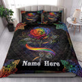 LGBT rainbow rose quilt bedding styled in a bright bedroom with matching floral artwork