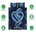 Dolphin quilt bedding displayed against a white background with soft, washable, and colorfast feature icons