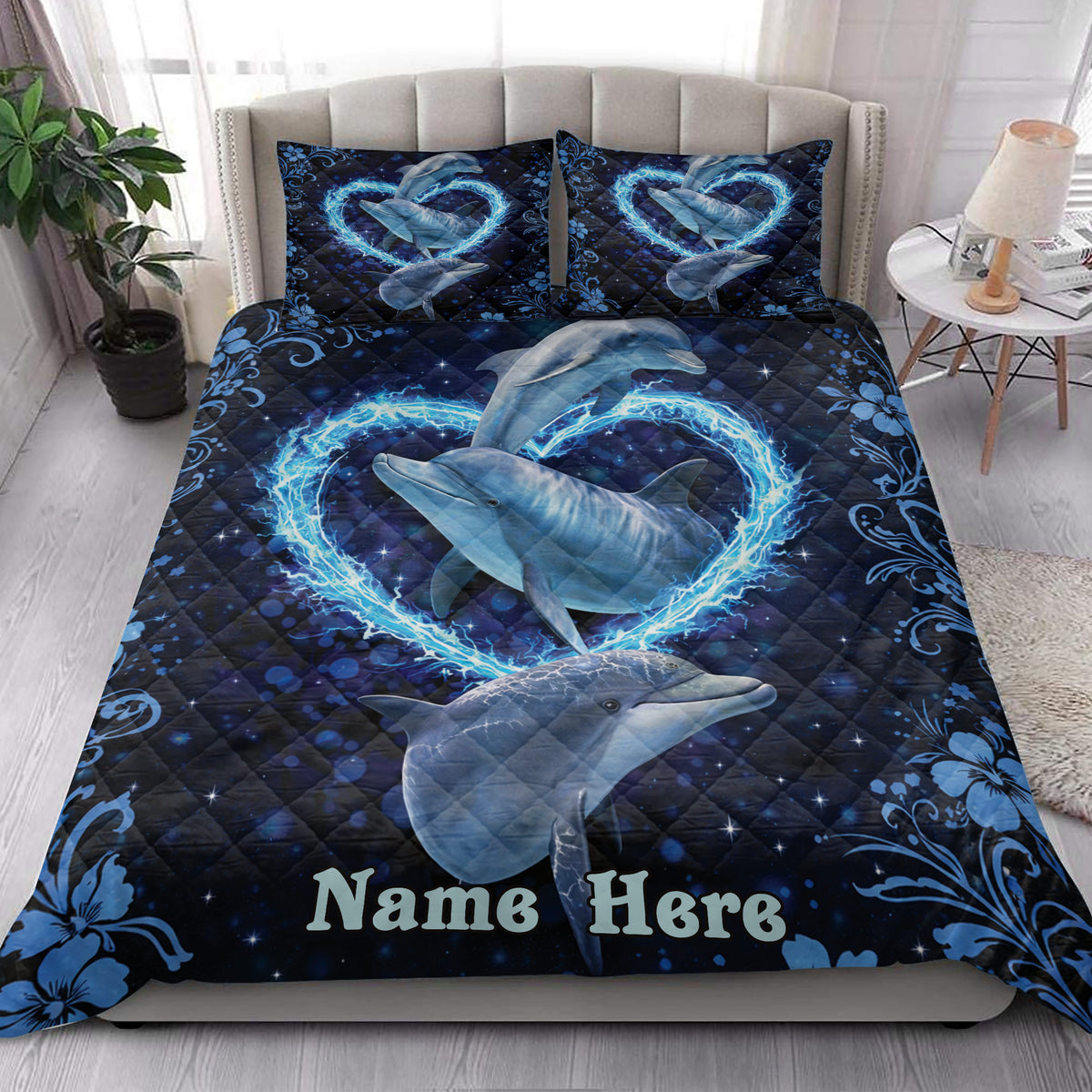 Dolphin quilt blanket styled in a bright bedroom with ocean-inspired blue artwork