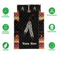 American Native quilt bedding set displayed with large feather artwork and bold geometric pattern borders
