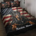 Rottweiler quilt blanket spread across a bed with patriotic American flag artwork and matching dog portraits