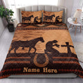 Western cowboy quilt styled on a bed with horse and rider silhouettes, horseshoes, and rustic bedroom decor