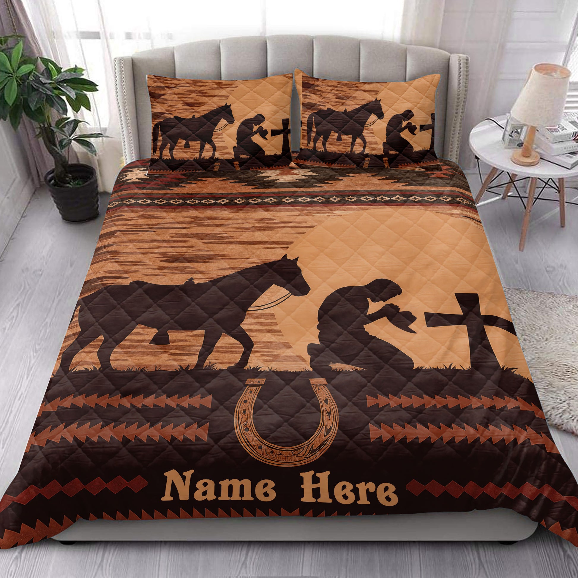 Western cowboy quilt styled on a bed with horse and rider silhouettes, horseshoes, and rustic bedroom decor