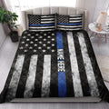 Thin Blue Line police quilt blanket styled across a modern bedroom with matching patriotic pillow designs