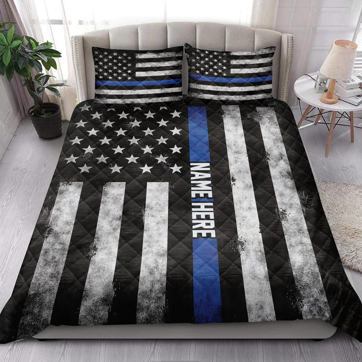 Thin Blue Line police quilt blanket styled across a modern bedroom with matching patriotic pillow designs