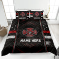 Firefighter quilt blanket displayed on a bed with black, red, and white fire department artwork