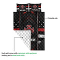 Firefighter quilt showing the printed front, white reverse backing, and stitched diamond pattern