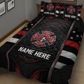 Close bedroom view of a black and red firefighter quilt with fire department emblem design
