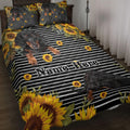 Dachshund quilt blanket with black and white stripes, sunflower accents, and bedroom styling