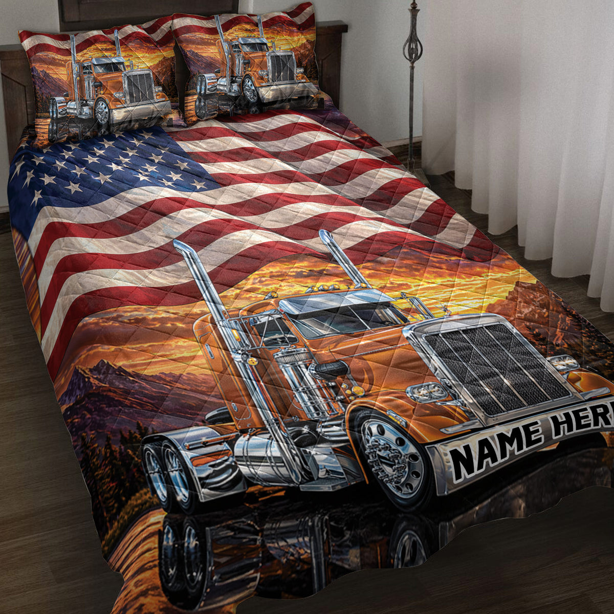 Trucker quilt blanket displayed on a bed with orange semi trucks, mountain sunset scenery, and American flag artwork