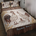 Chicken quilt blanket displayed on a bed with rooster and hen artwork in warm farmhouse colors