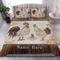 Farmhouse chicken quilt blanket styled on a bed with matching rooster and hen pillow artwork