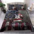 Lacrosse quilt bedding styled in a bright bedroom with player, stick, and patriotic artwork
