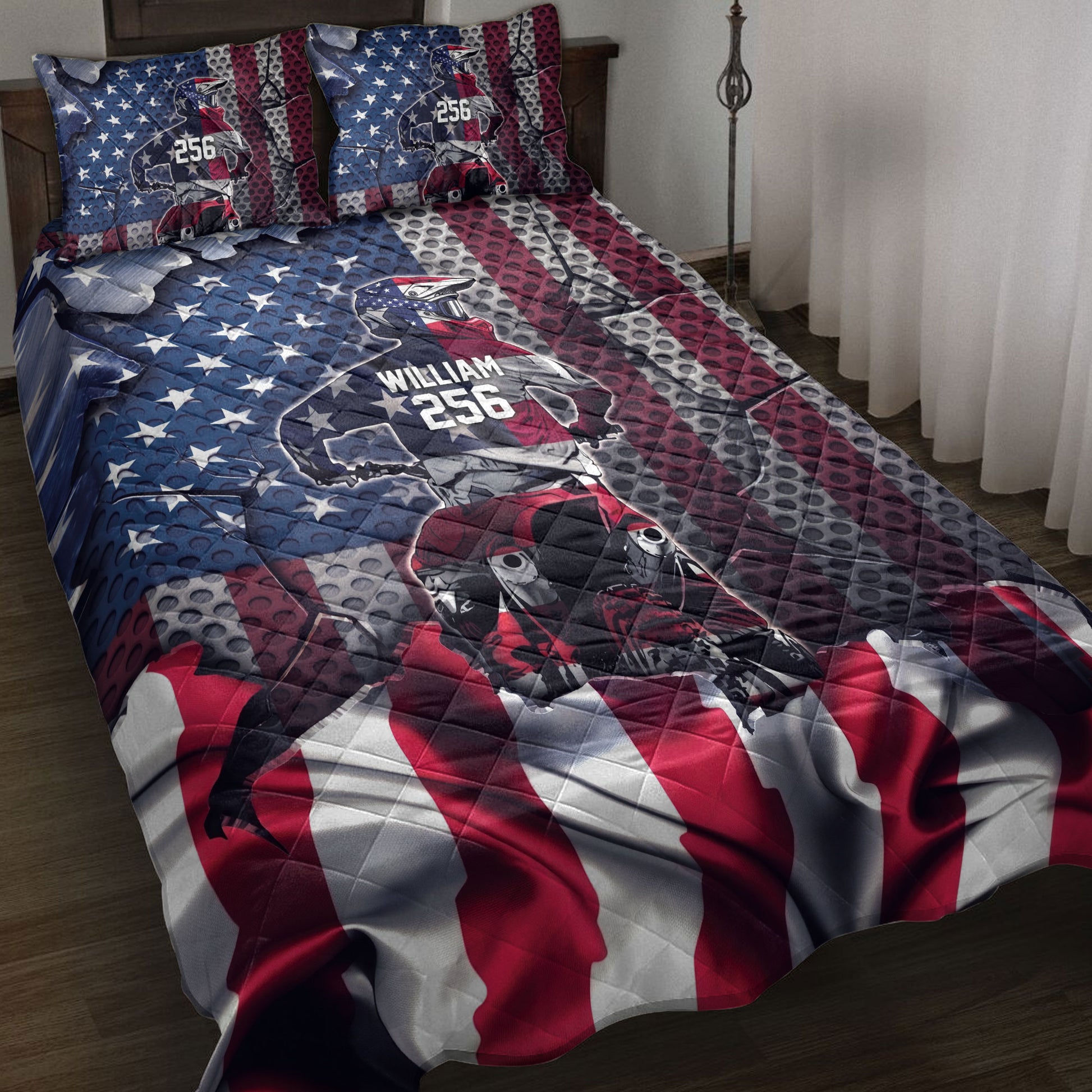 Motocross quilt bedding set displayed on a bed with dirt bike rider artwork and red, white, and blue racing graphics