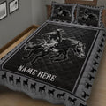 Black rodeo quilt blanket on a bed with Western cowboy artwork and horse-print borders