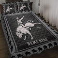 Rodeo quilt blanket featuring a cowboy riding a bucking bull in bold black and gray western artwork