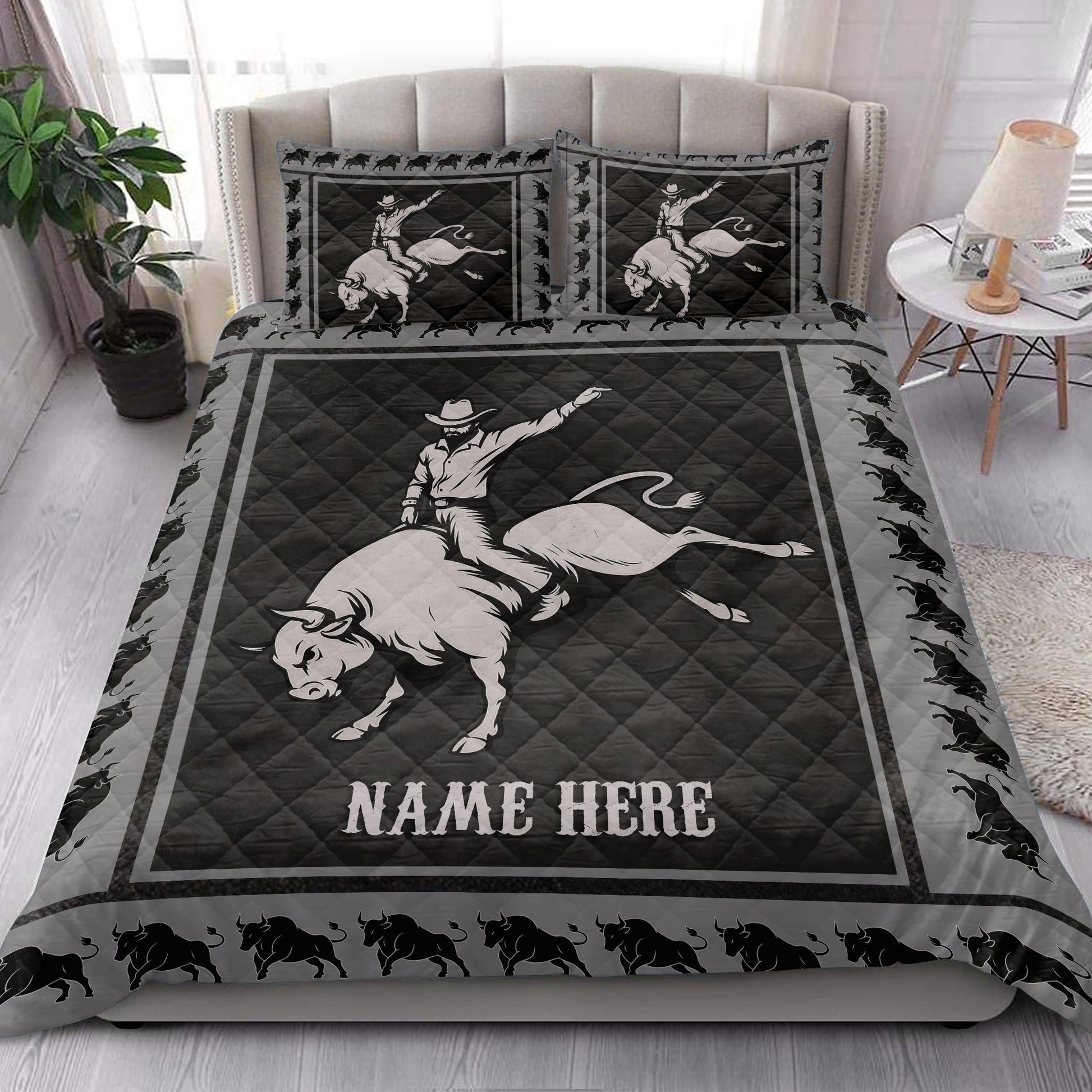 Rodeo quilt bedding styled on a bed with dramatic bucking bull and cowboy western artwork