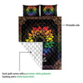 LGBTQ pride quilt showing a colorful sunflower print front and white quilted backing