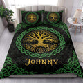 Tree of Life quilt bedding styled in a bright bedroom with golden tree artwork and green Celtic borders