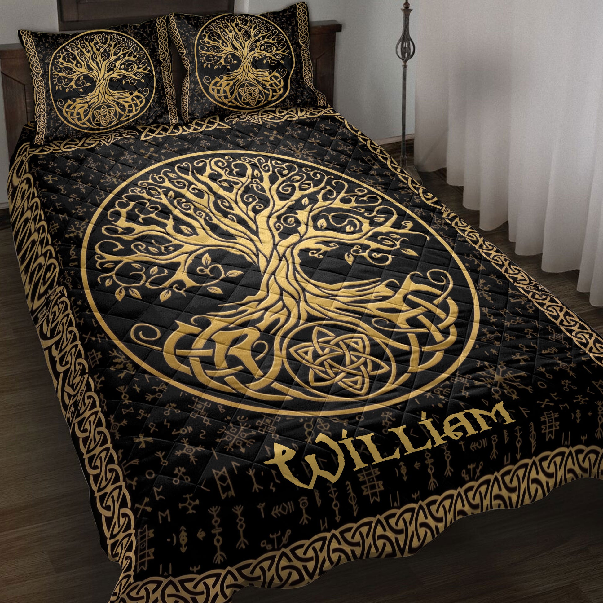 Black and gold Tree of Life quilt blanket displayed on a bed with Celtic knot borders