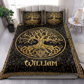 Black and gold Tree of Life quilt bedding styled in a bright bedroom