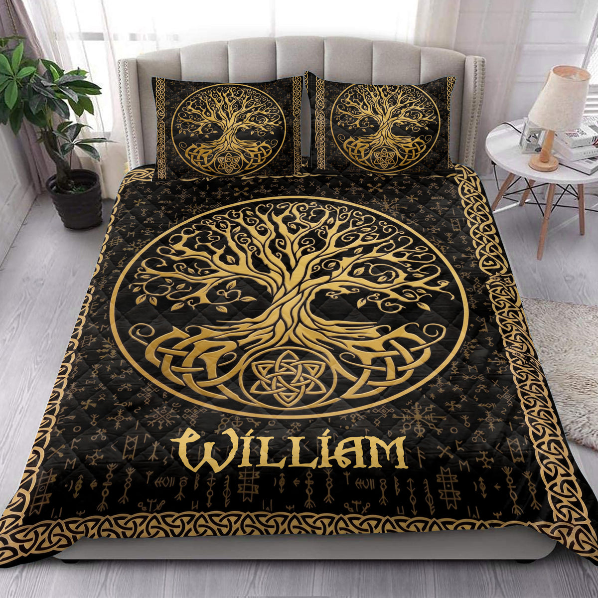 Black and gold Tree of Life quilt bedding styled in a bright bedroom