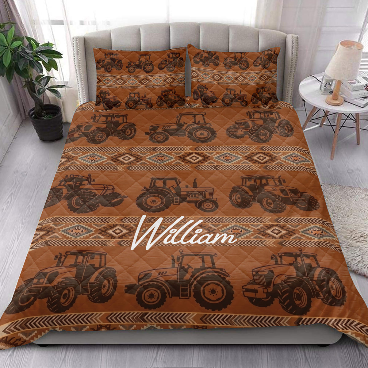 Tractor quilt bedding styled in a bright bedroom with matching tractor-patterned pillow covers
