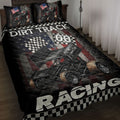 Dirt track racing quilt blanket displayed on a bed with sprint cars, checkered flags, and patriotic artwork