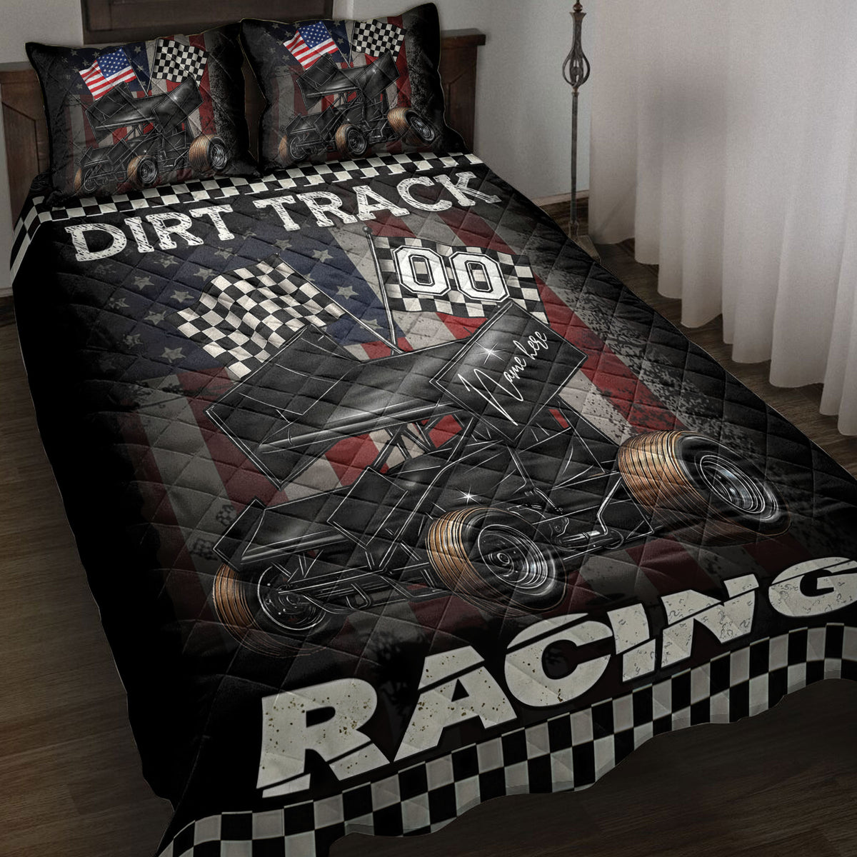 Dirt track racing quilt blanket displayed on a bed with sprint cars, checkered flags, and patriotic artwork