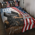 Dirt track racing quilt blanket displayed on a bed with sprint cars, American flag stripes, and racing artwork